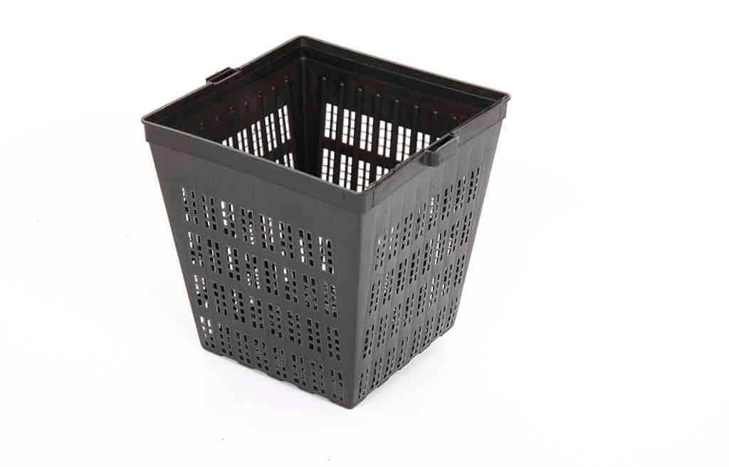 Black plastic ventilated square basket with perforated sides on white background