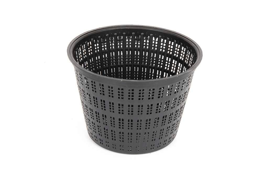 Black plastic perforated planting pot with round shape on a white background