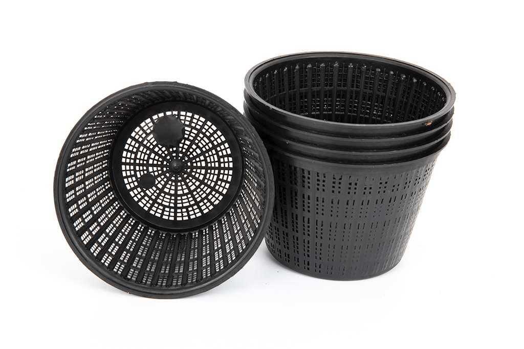 Set of black plastic mesh nursery pots for plant propagation and gardening